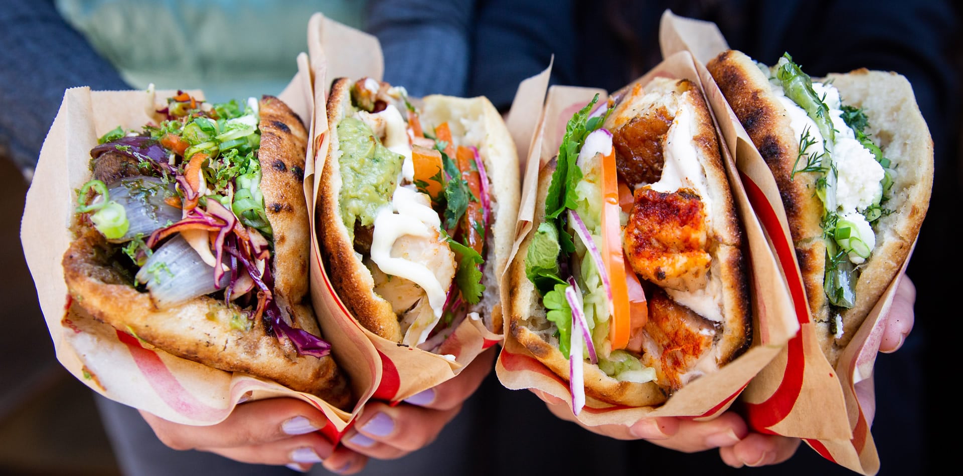 Four of PITTABUN's main menu items, including meat, vegetarian and vegan options